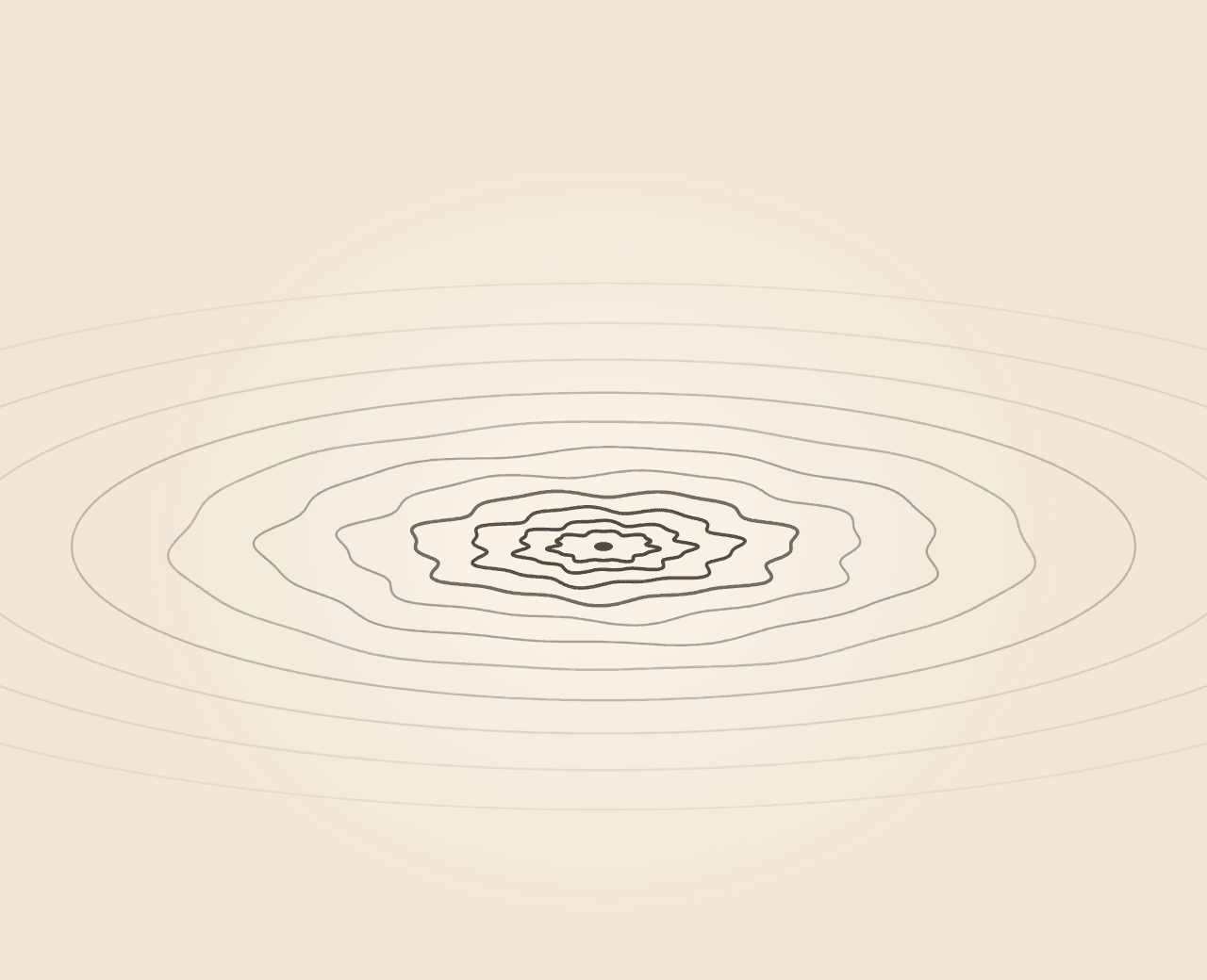 Ripples on still water, tight and uneven at the centre, widening into calm rings